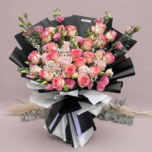 Luxury bouquet with light pink roses, lisianthus, baby’s breath, and eucalyptus fillers
