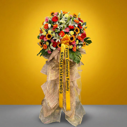Grand opening flower stand with sunflowers, gerbera, and stargazer lilies