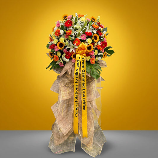 Grand opening flower stand with sunflowers, gerbera, and stargazer lilies