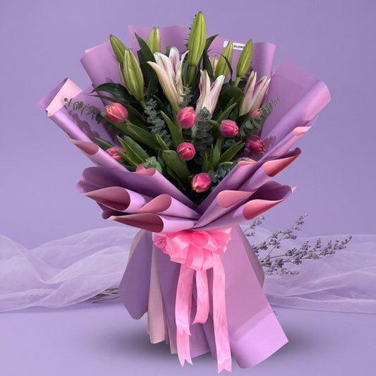 Fuchsia pink tulip bouquet with stargazer lilies and eucalyptus