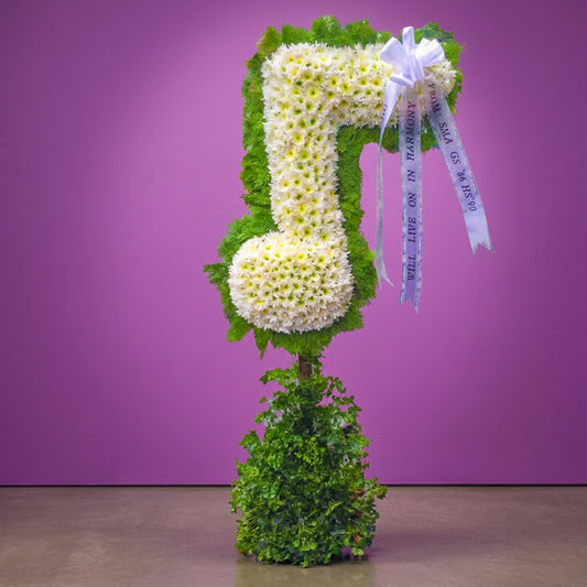Note Memory Funeral Stand with Malaysian mums, Papua leaves, and cypress leaves for music-themed funeral tributes