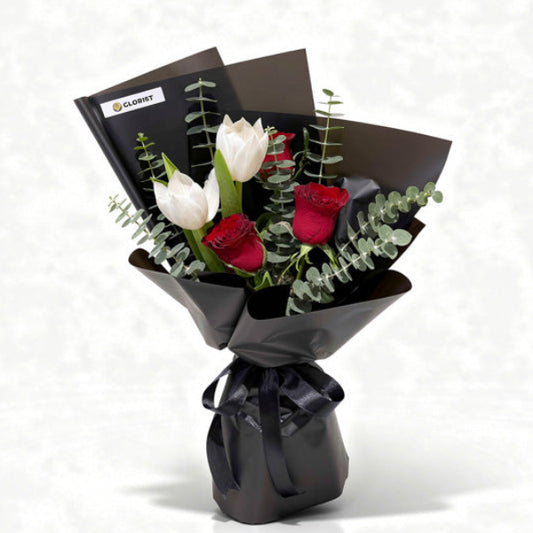Onyx Love bouquet with white tulips, red China roses, and eucalyptus Baby Blue, wrapped in black Korean paper with black ribbon — same-day delivery Manila