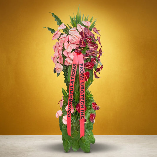 Optimistic Launch Inaugural Stand with pink and red anthurium and anahaw leaves for grand opening celebrations