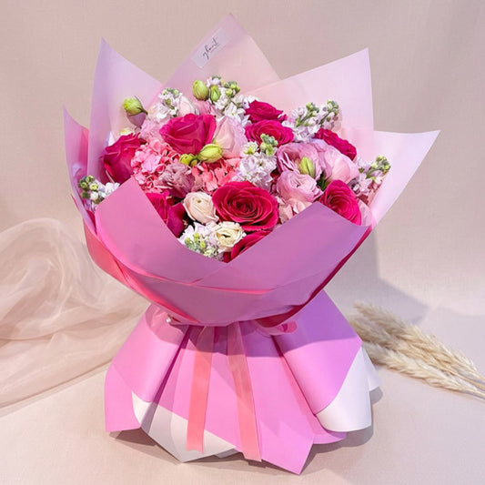 Pink China roses bouquet with lisianthus and matthiola in Korean-style wrapping