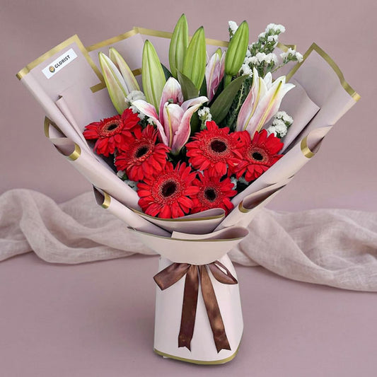 Pink stargazer lily and red gerbera bouquet with Korean-style wrapping