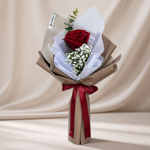 Pleasant Dreamland bouquet with red Ecuadorian rose, baby’s breath and eucalyptus wrapped in café-toned paper with maroon ribbon for Metro Manila delivery