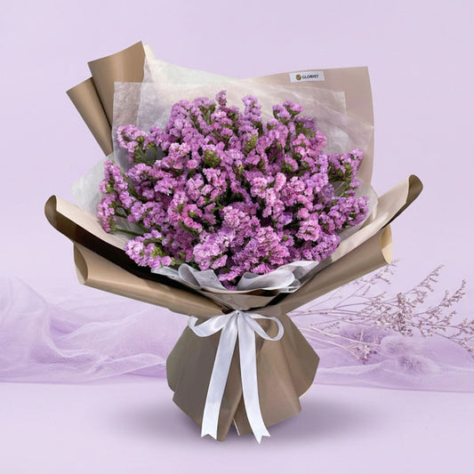 Purple statice bouquet with café Korean-style wrapping and white ribbon