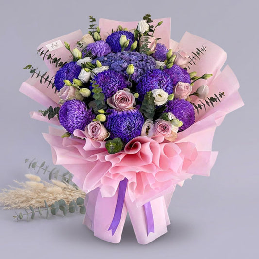 Purple hydrangea and pink China rose bouquet with lisianthus and eucalyptus fillers