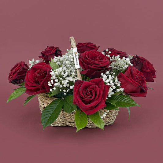 Twelve red Ecuadorian roses with gypsophila baby's breath in a handwoven basket, a luxury anniversary and Valentine's Day gift with same-day Metro Manila delivery