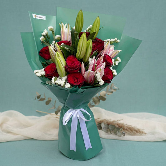 Red rose and stargazer lily bouquet with emerald green Korean-style wrapping