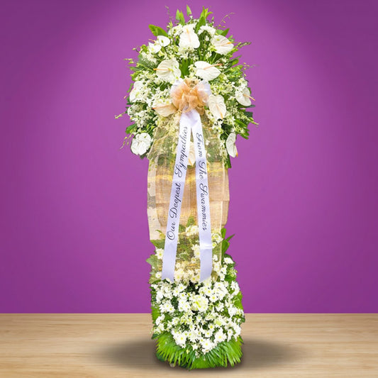 Remembered Memory funeral stand with 12 anthuriums, orchids, Malaysian mums and green line & anahaw leaves — sympathy tribute for Metro Manila