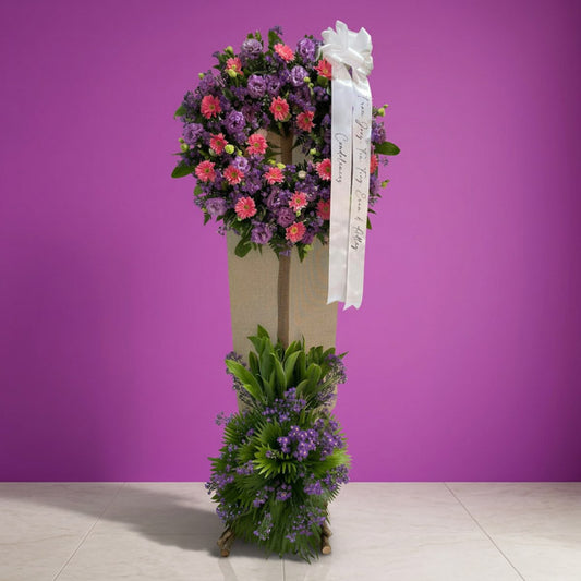 Gerbera and violet aster funeral flower stand arrangement