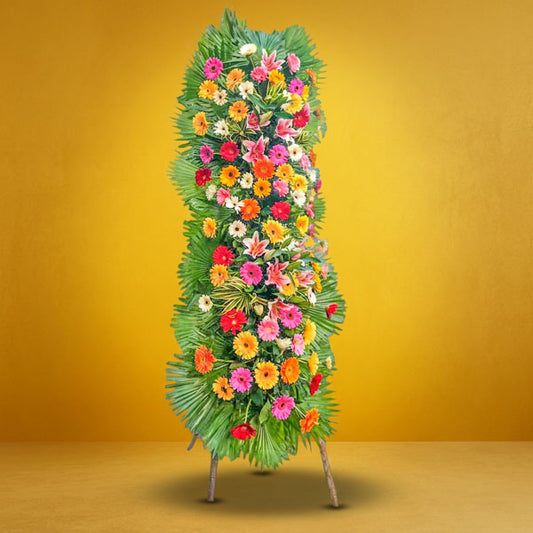 Right Launch Inaugural Stand with stargazer lilies, assorted gerbera daisies, yellow corn leaves, and anahaw leaves