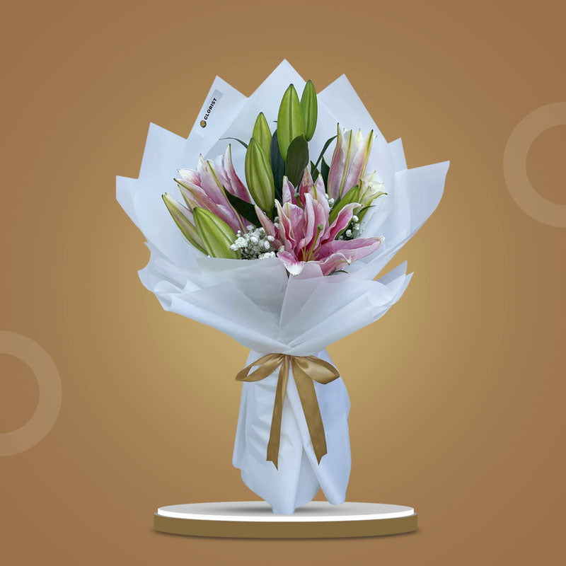 Romantic Breeze bouquet with 3 Stargazer lilies and gypsophila wrapped in white Korean paper with light gold ribbon