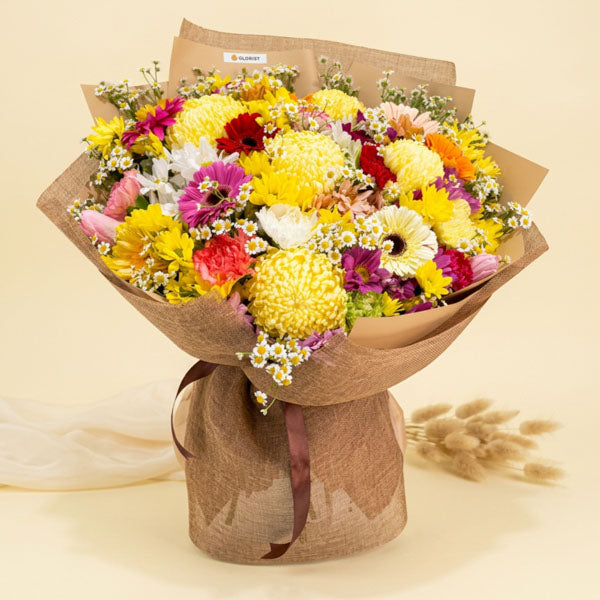 Luxury bouquet with assorted gerbera, carnations, tulips, and sunlight flowers