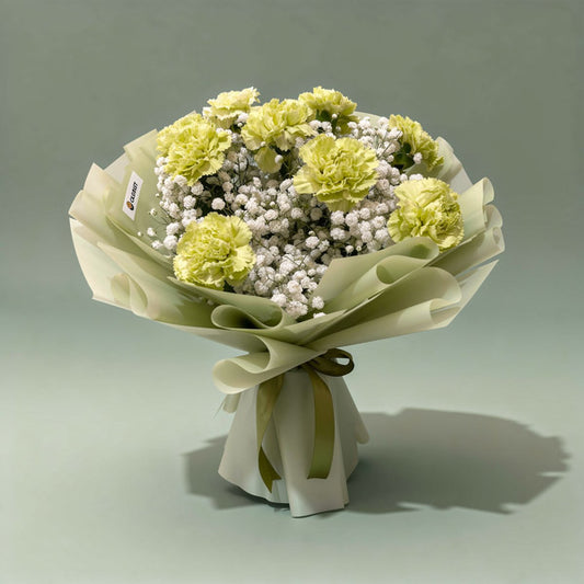 Sacred Radiance bouquet with green carnations and gypsophila baby’s breath in green wrap with olive ribbon — same-day delivery Manila