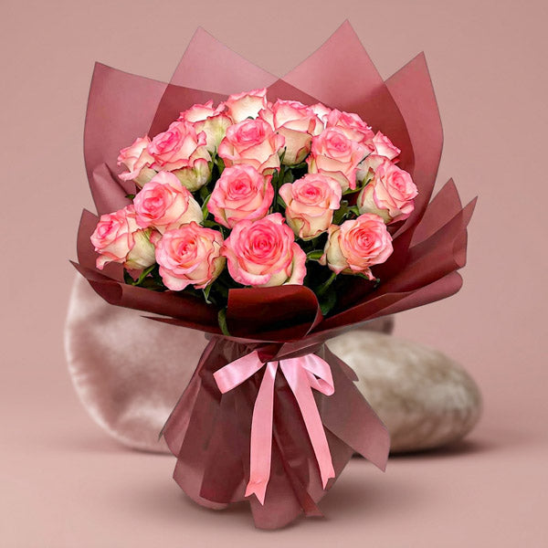 Shining Flora bouquet with 20 2‑toned light pink China roses in coffee‑maroon wrap tied with a medium‑pink ribbon