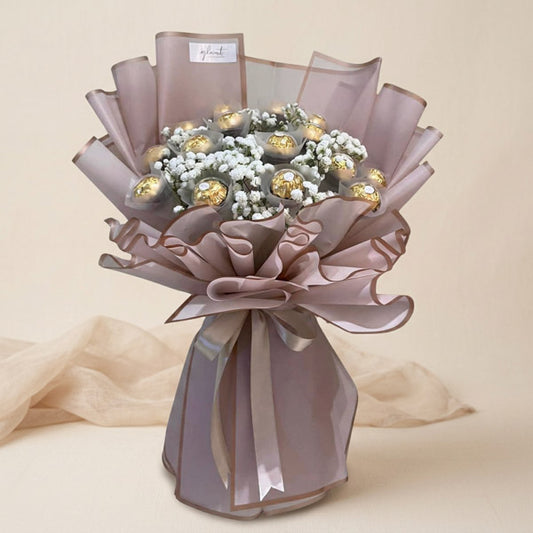 Soulful Sweets chocolate bouquet with 16 Ferrero Rocher and gypsophila baby’s breath in dirty pink Korean wrap — same-day delivery Manila