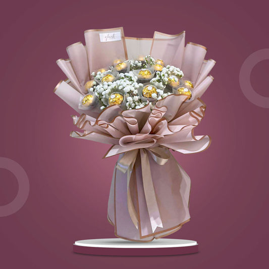 Soulful Sweets chocolate bouquet with 16 Ferrero Rocher and gypsophila baby’s breath in dirty pink Korean wrap — same-day delivery Manila