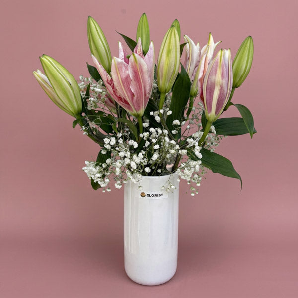 Fragrant stargazer lilies with gypsophila baby's breath in a glass vase, a housewarming and thank-you flower gift with same-day Metro Manila delivery