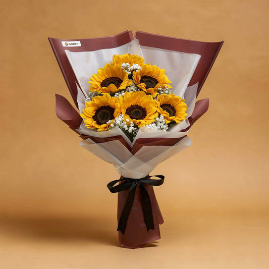 Steadfast Summer Flower Bouquet with six sunflowers and white baby’s breath wrapped in maroon and white Korean wrap with a black ribbon