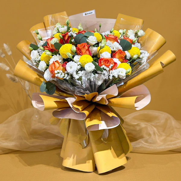 Yellow orange imported rose bouquet with lisianthus and pompom chrysanthemums