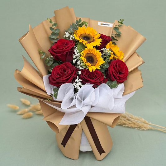 Sunflower and Ecuadorian rose bouquet with baby’s breath and eucalyptus fillers