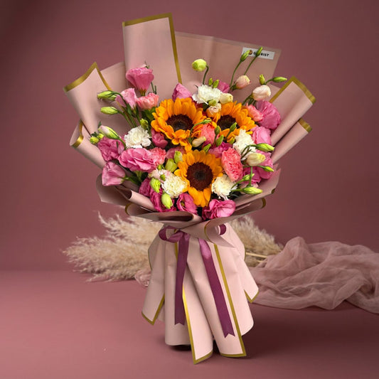 Sunflower bouquet with pink lisianthus and carnations in Korean-style wrapping