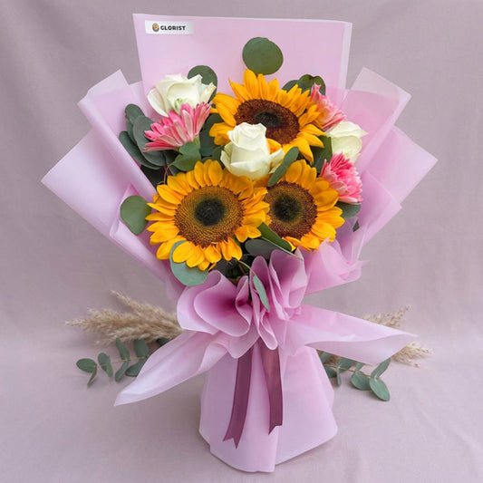Sunflower bouquet with white roses, pink gerberas, and eucalyptus fillers
