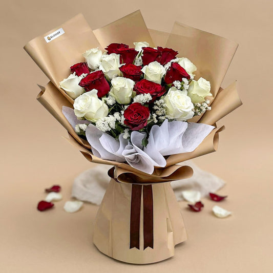 Swift Flora bouquet with 10 red China roses, 10 white China roses, and white statice in kraft and white wrap with brown ribbon