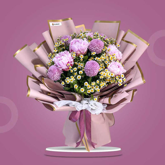 Tranquil Love bouquet with pink peonies, pink pompoms, and egg aster in dirty pink Korean wrap with gold lining — same-day delivery Manila