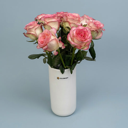 Ten two-toned light pink China roses with a soft color gradient in a white glass vase, an elegant gift with same-day Metro Manila delivery