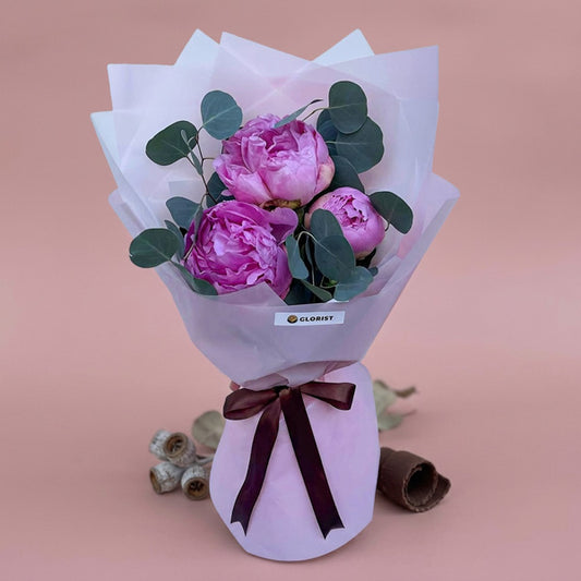 Well Fusion Flower Bouquet with 3 purple peonies, eucalyptus silver dollar, light violet Korean wrap, and brown ribbon
