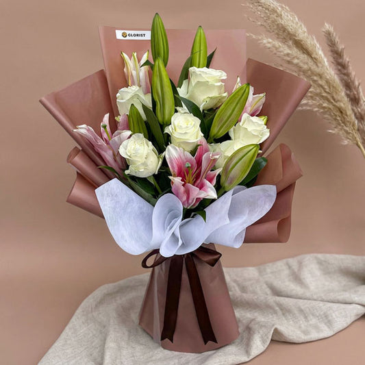 White rose and stargazer lily bouquet with elegant Korean-style wrapping