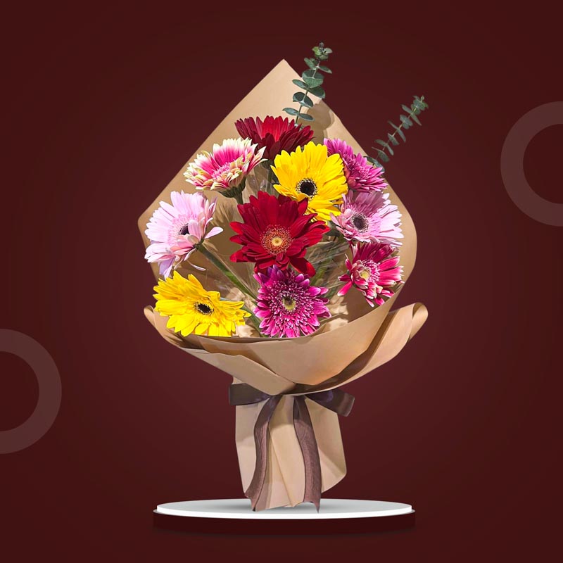 Witty Adoration bouquet with 10 assorted color gerbera daisies and eucalyptus Baby Blue, wrapped in kraft paper with brown ribbon — same-day delivery Manila