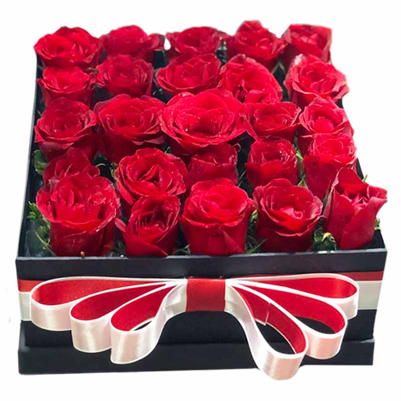 Box of 25 Red Roses with Satin Ribbon, a stunning floral arrangement for your special moments and celebrations. Order now and make a lasting impression.