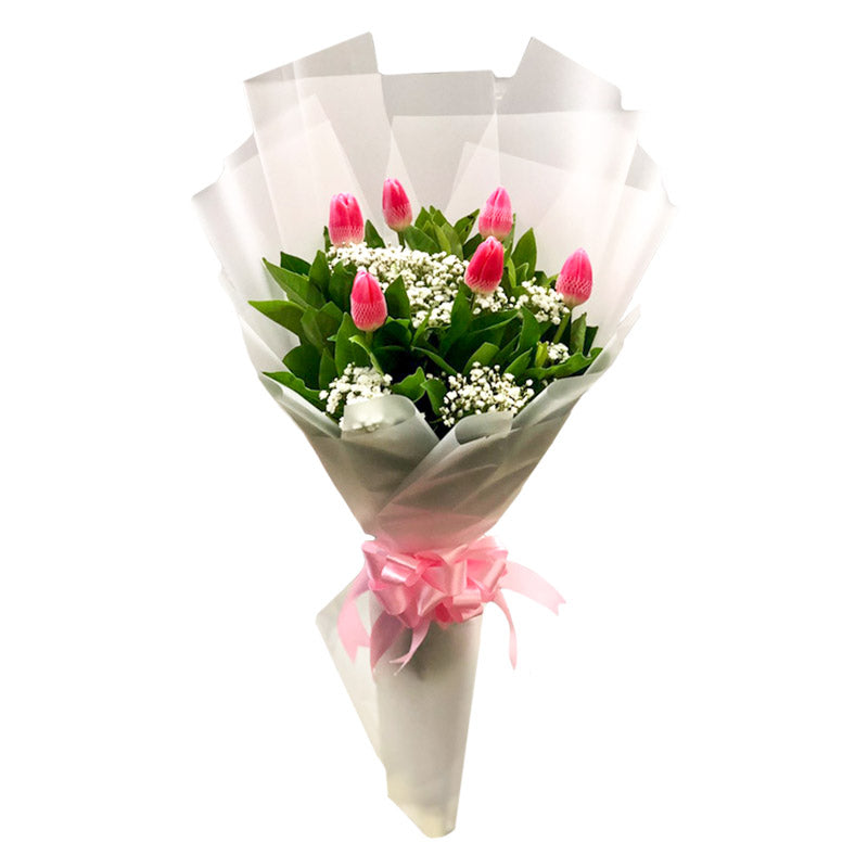 Enchanting bouquet: 6 pink tulips with delicate gypsophila fillers. Presented in a Korean wrap, tied with a satin ribbon for a touch of elegance.