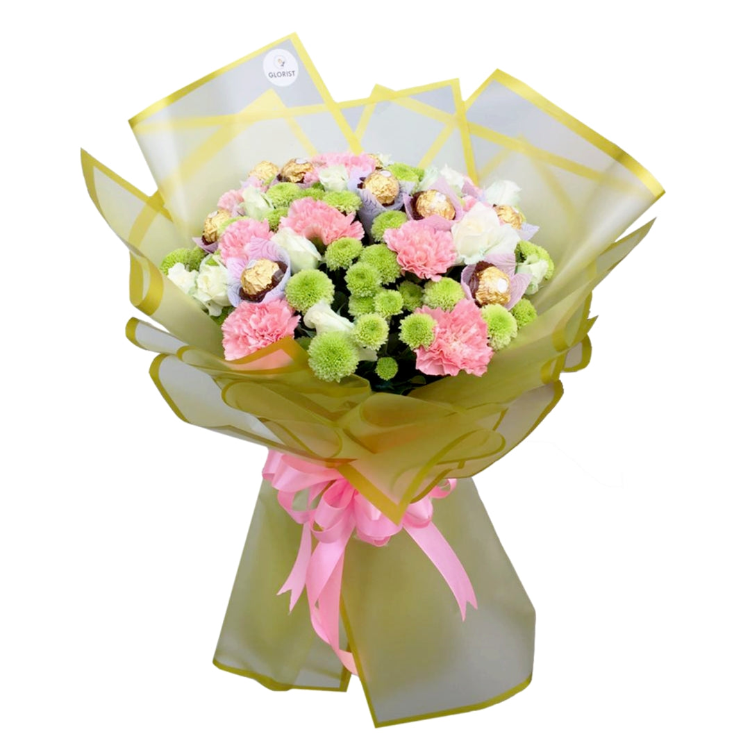 Elegant bouquet: 10 carnations, a dozen white roses, 10 Ferrero Rocher chocolates, green buttons fillers. Korean-style wrap with satin ribbon.