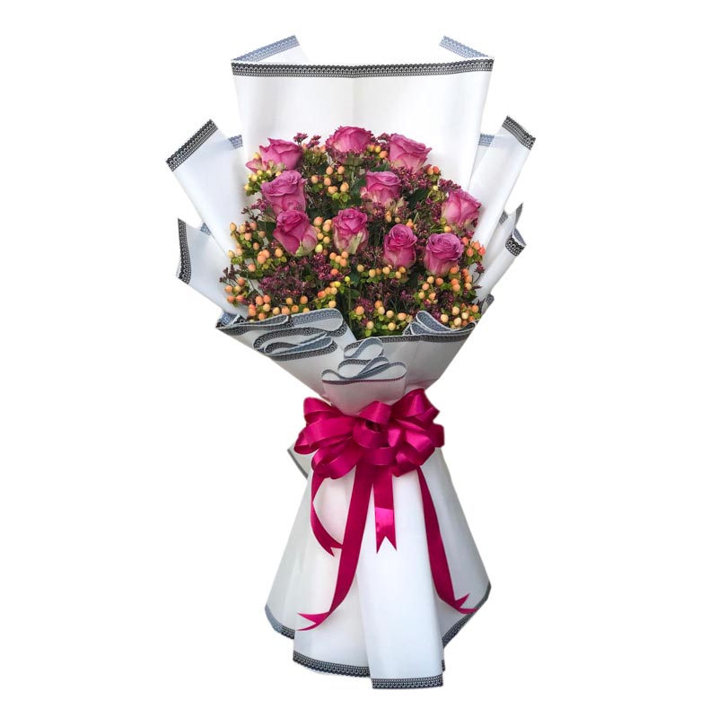 A captivating bouquet of 10 luxurious purple Ecuadorian roses, beautifully complemented by vibrant hypericum berries. The roses are elegantly presented in a Korean-style wrap with a border design, accentuated by a stylish satin ribbon. This stunning arrangement is perfect for adding a touch of elegance and charm to any occasion.