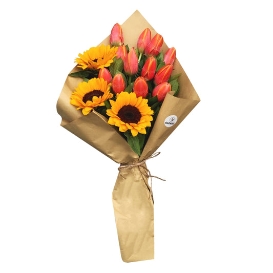 Stunning Bouquet of 12 Tulips and 3 Sunflowers in Rustic Kraft Paper Wrap: Embrace the beauty of nature with this breathtaking bouquet. It features a vibrant collection of 12 tulips and 3 sunflowers, carefully arranged to showcase their radiant colors and delicate petals. The bouquet is elegantly presented in a rustic Kraft paper wrap, adding a charming and natural touch to its overall appeal. Perfect for brightening up any space or making a memorable gift for your loved ones.