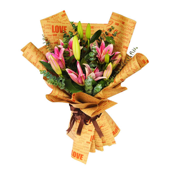 Elegant bouquet featuring three stunning Stargazer lilies adorned with fresh eucalyptus leaves. Presented in a chic Kraft paper wrap with a luxurious satin ribbon. Perfect for special occasions and gifts.